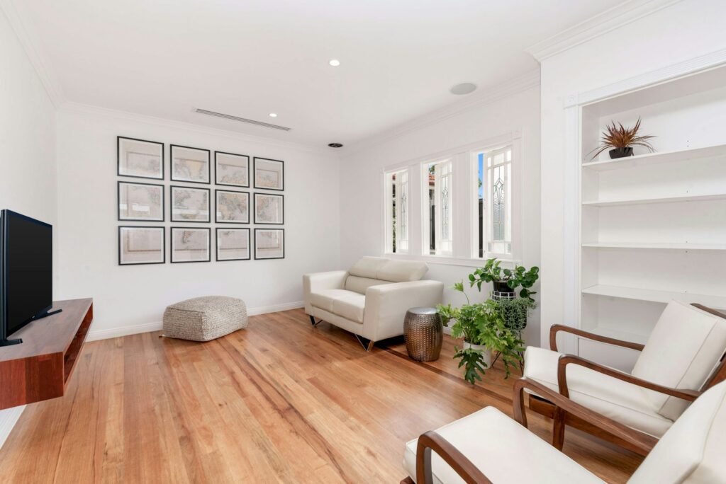 a living room filled with furniture and a flat screen tv